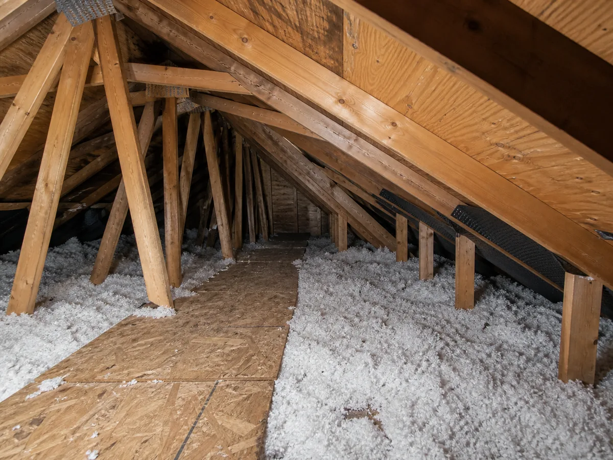 Attic roof framing and insulation during a residential home inspection